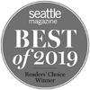 A round badge showing "Seattle Magazine Best of 2019 Readers' Choice Winner" in white text on a gray background.