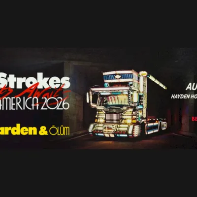 A concert banner for The Strokes North America 2016, &ldquo;The Garden & Gun,&rdquo; showing a robot truck and Bend, OR Aug 25th.